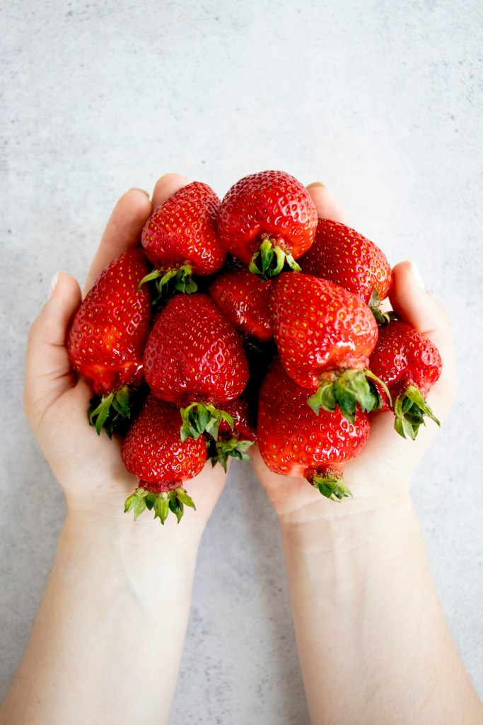 Strawberries in two hands